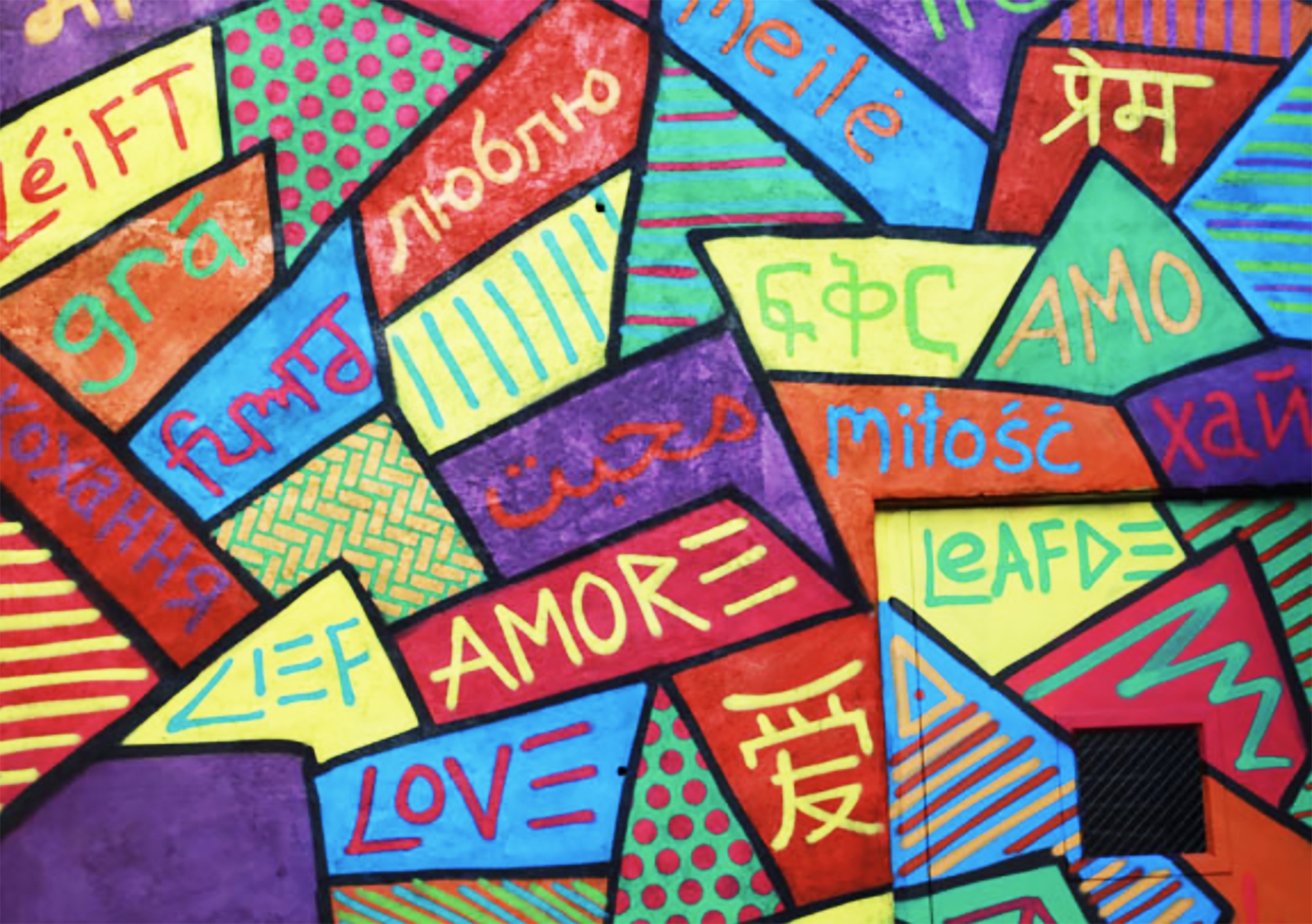 Brightly colored shapes with contrasting text in each shape. Love in any languages.