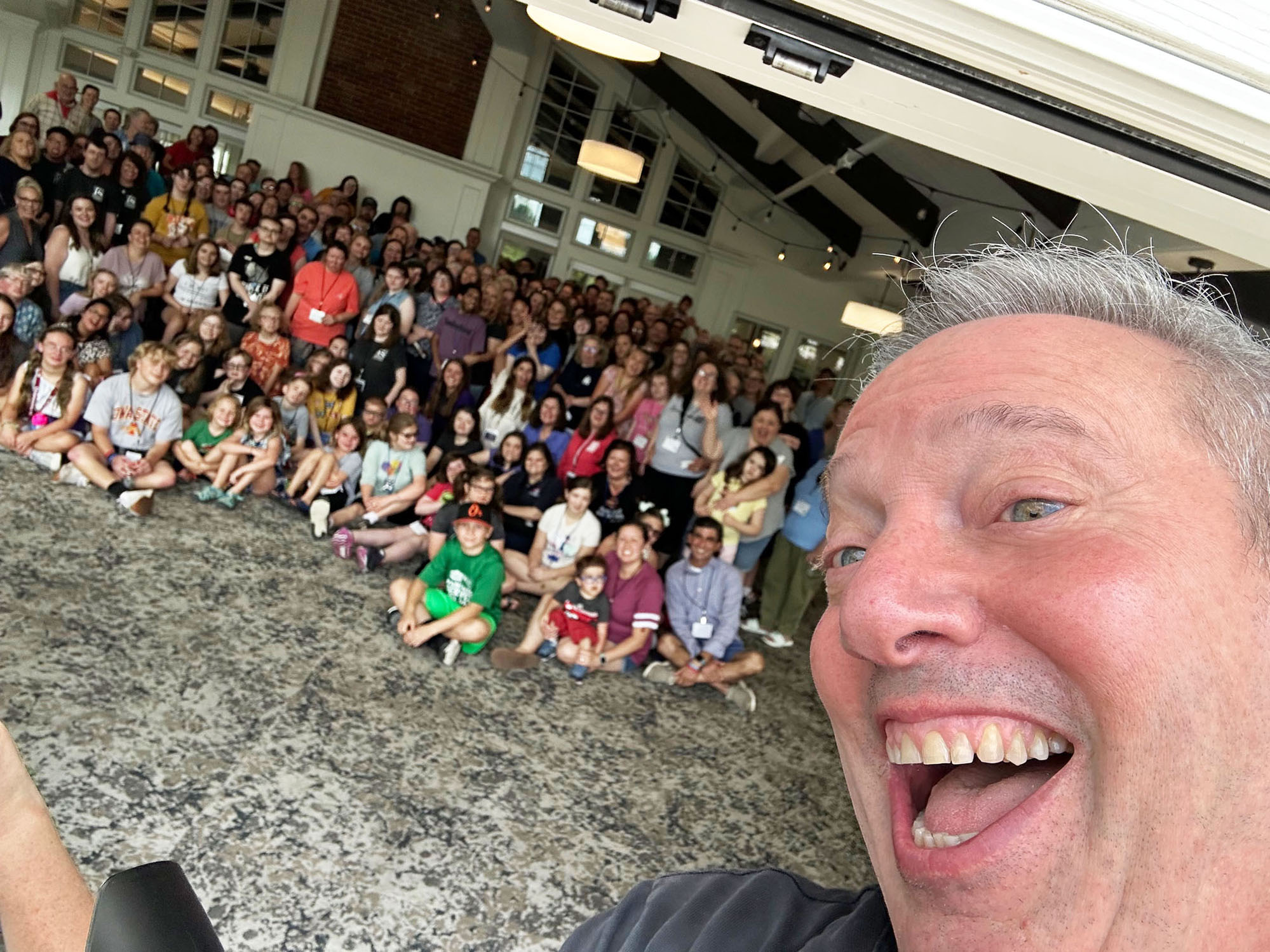 Rick Selfie A selfie with Rick and a large group of people behind him.