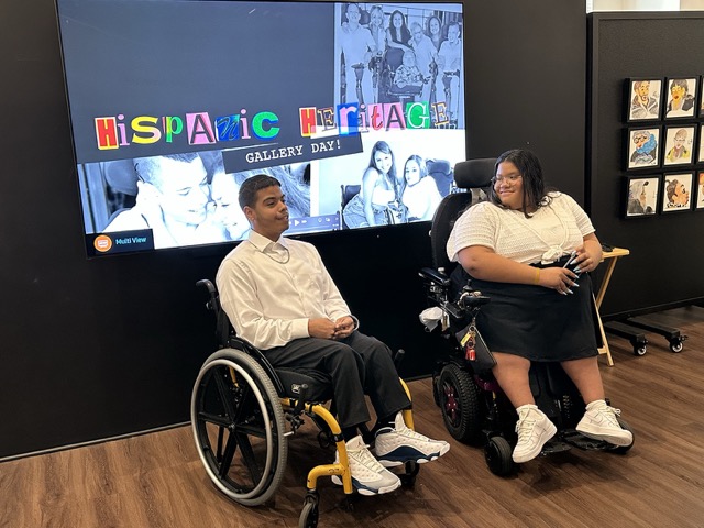 IMG_0516 Medium brother and sister in wheelchair speaking.