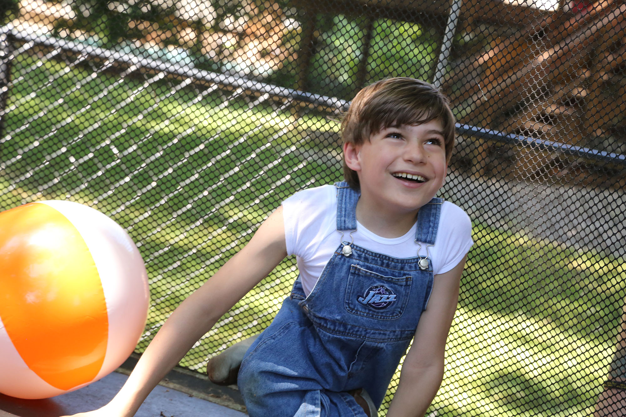 Young boy with Sacral agenesis Caudal Regression on trampoline