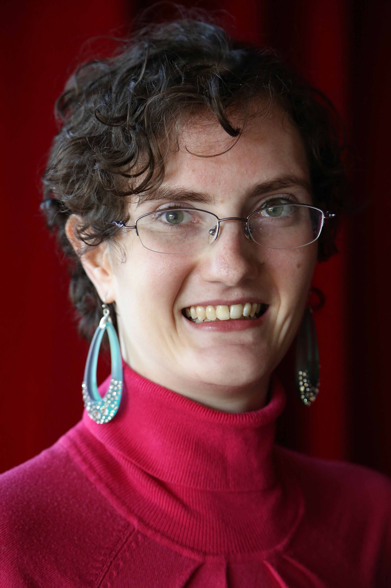 Picture of a person with Familial Dysautonomia looking at camera and smiling