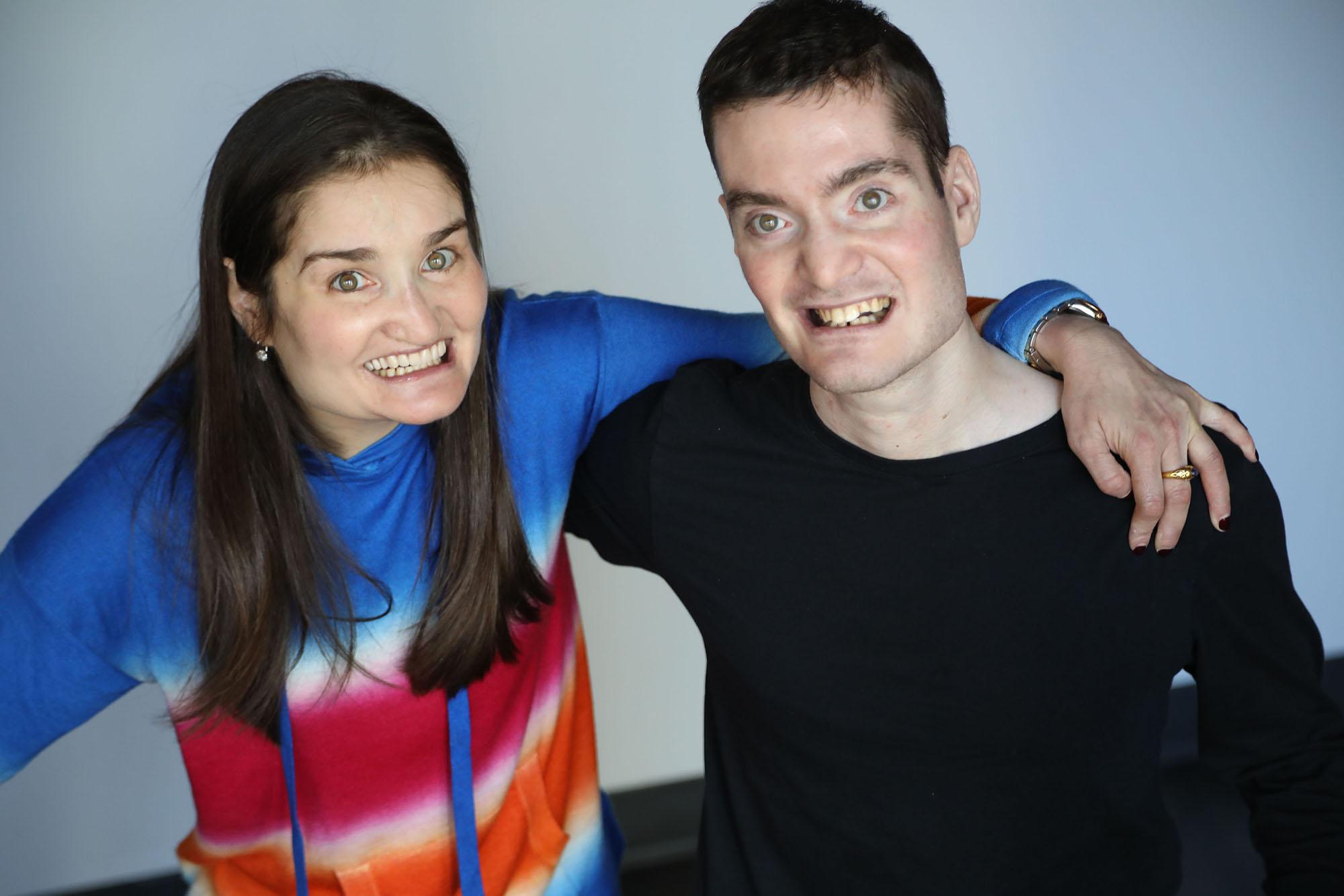 Two people one male and one female, pose together. They both have Familial Dysautonomia