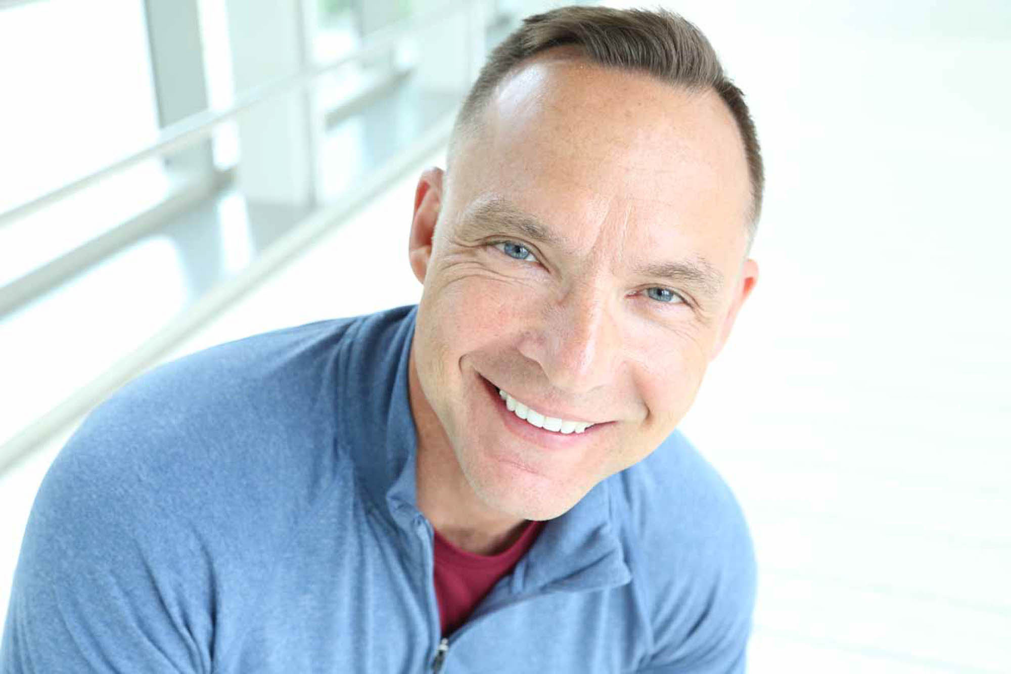 man with Vitiligo smiling looking into the camera