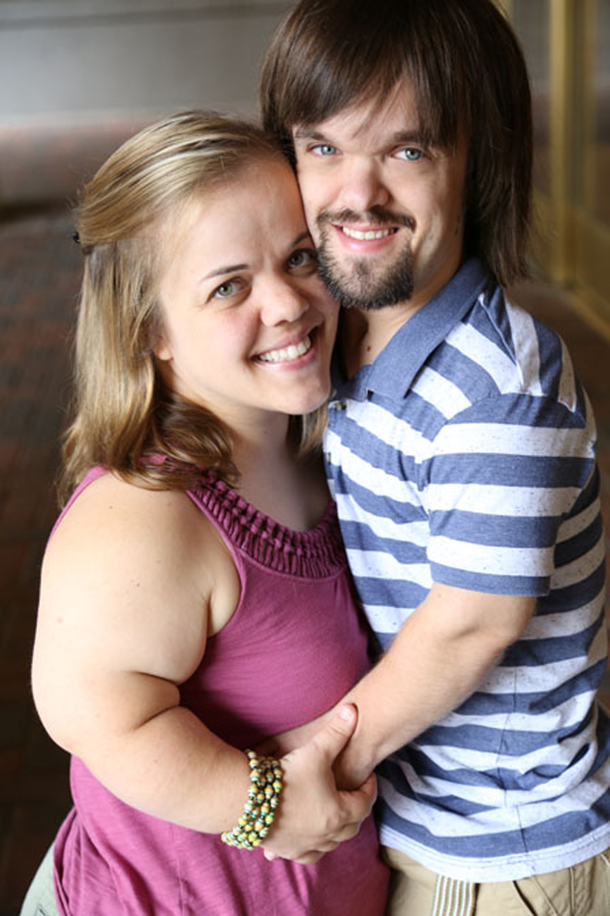 young couple hug eachother, both have skeletal dysplasia