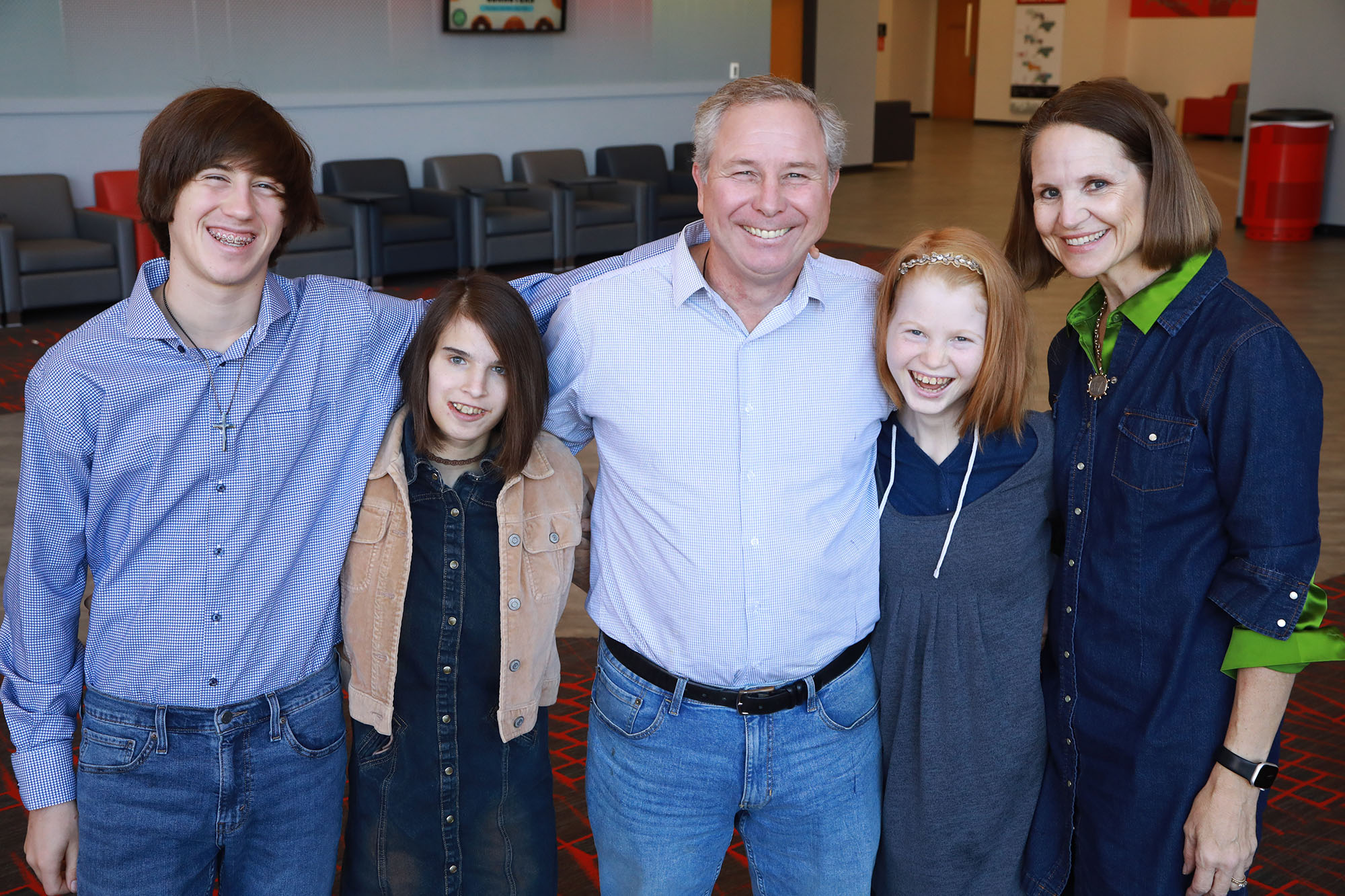 family of 4 smiling