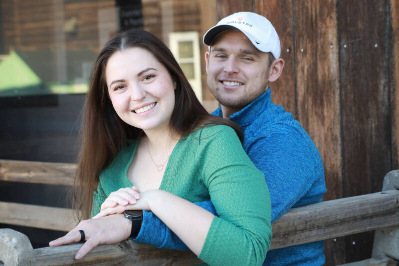 Couple sitting on a porch.