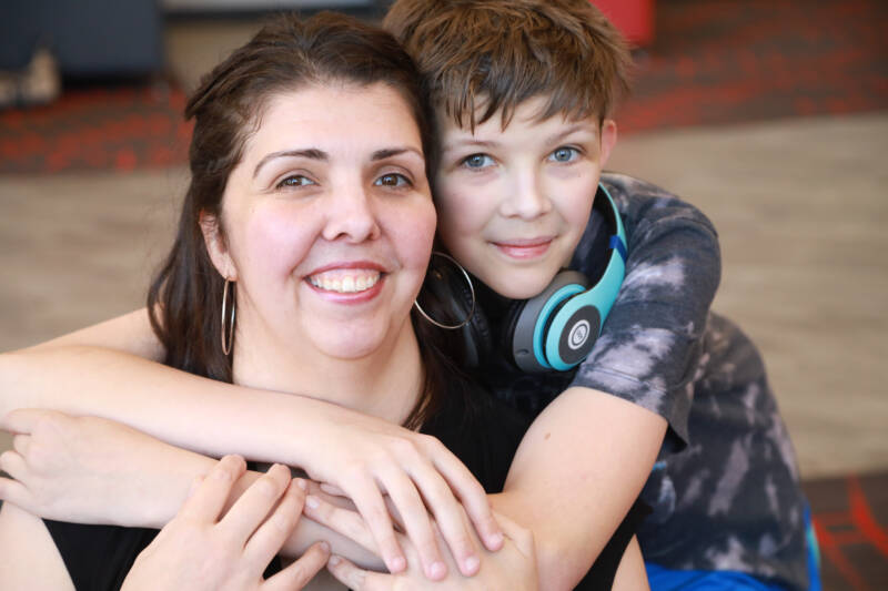 Mom and son hugging