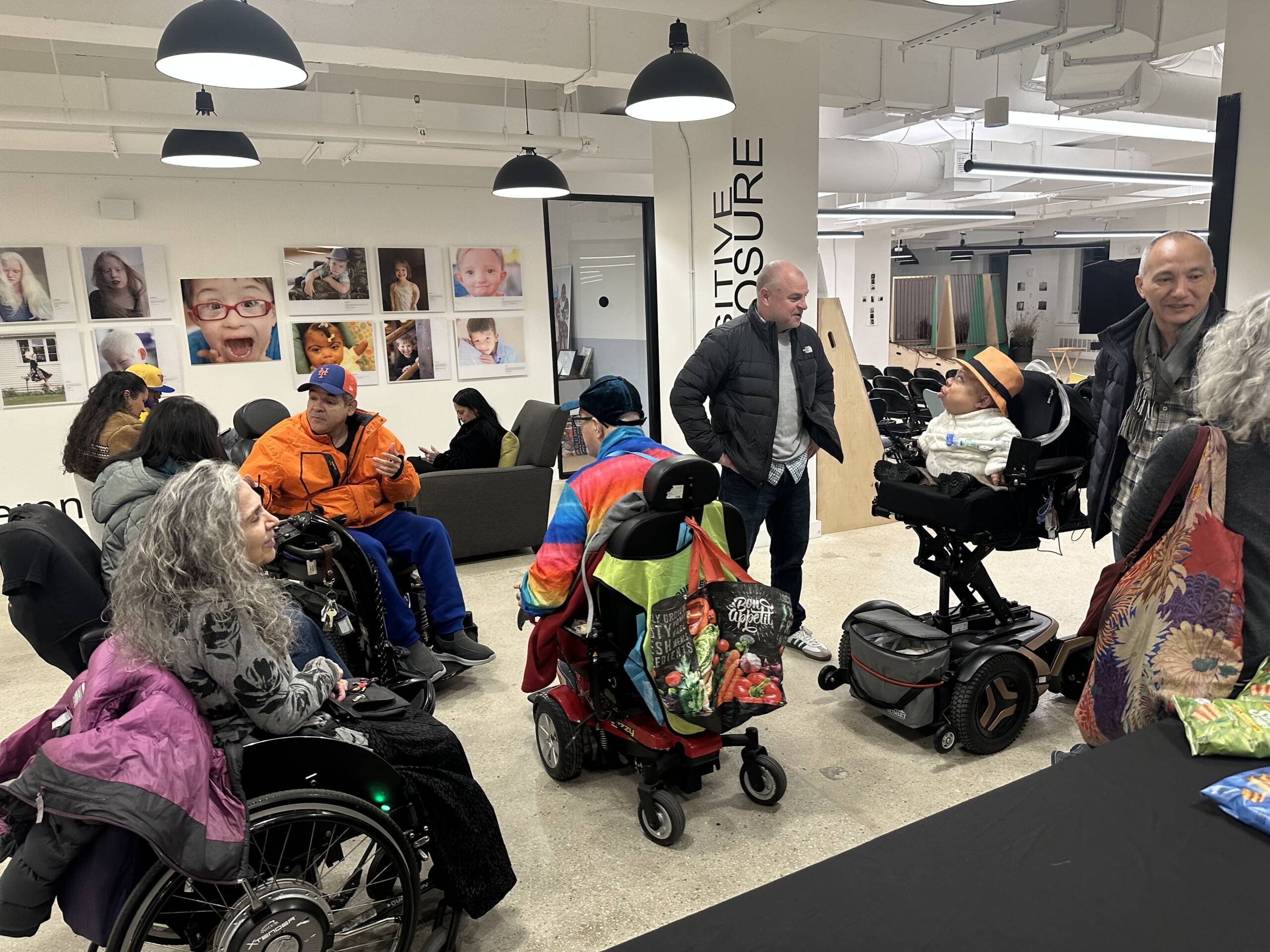 People gathering in the gallery area ahead of the film screening.