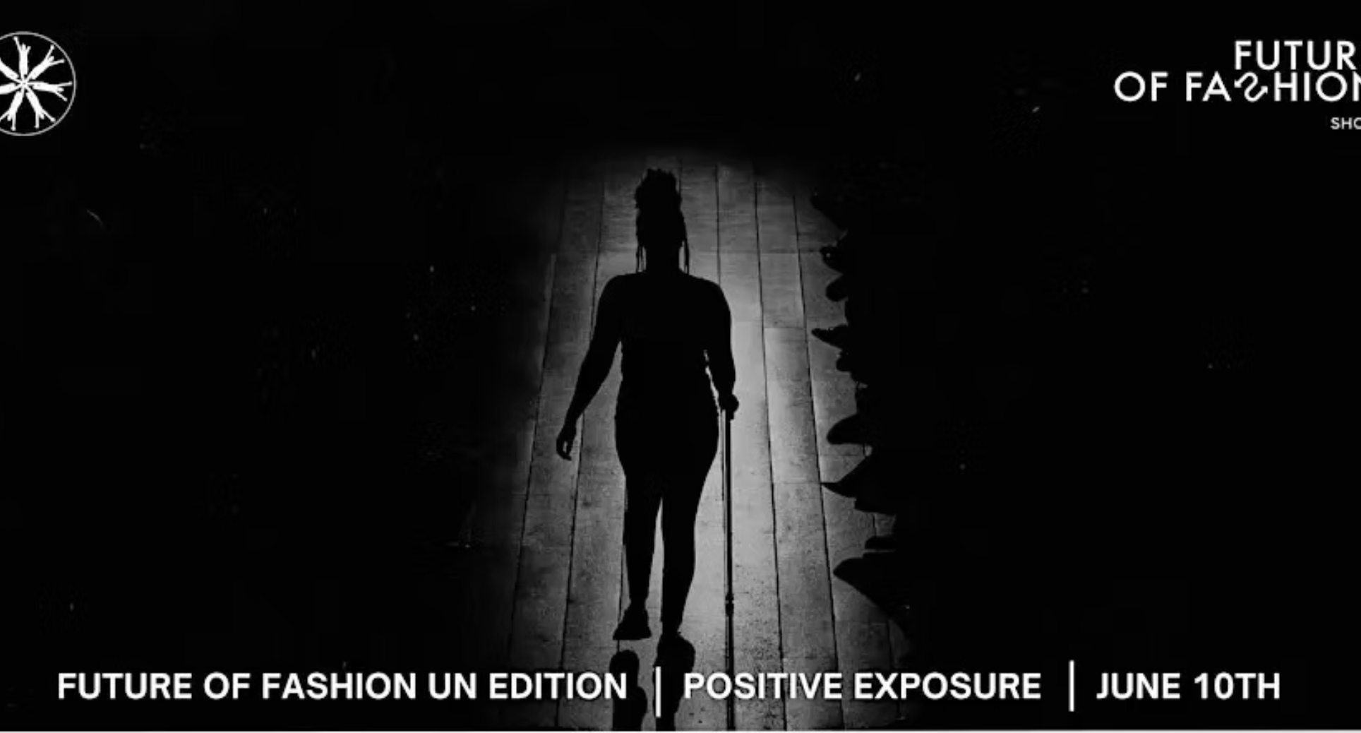 Black and white image of Figure walking on a runway silhouetted by darkness and light.